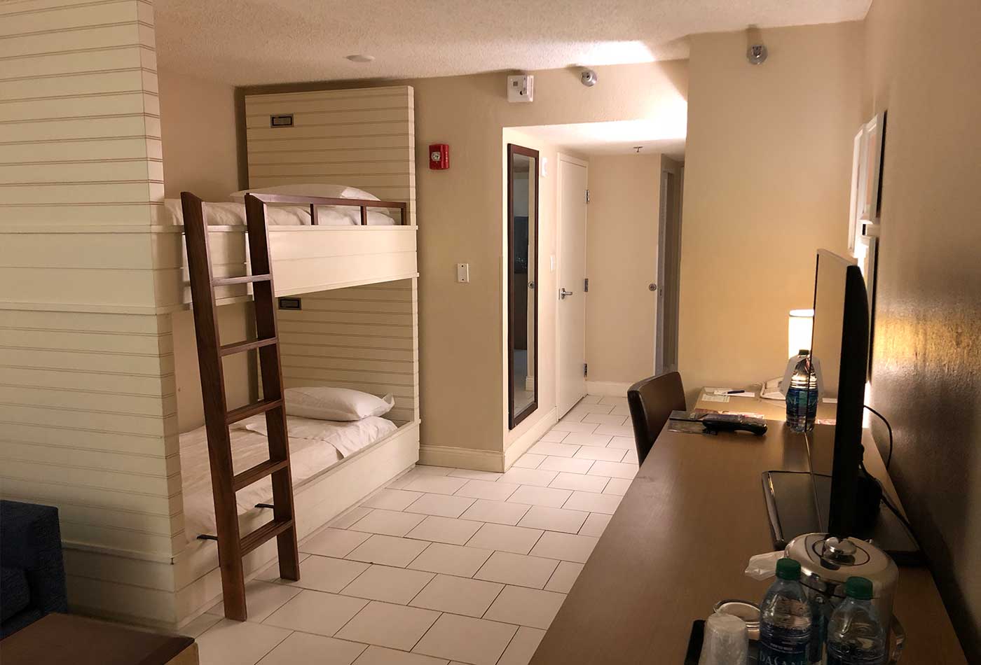 Two bunk beds in accessible family hotel room.