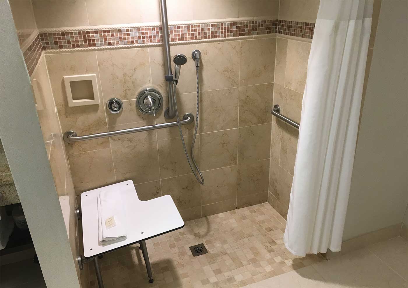 Roll-in shower with built-in seat.