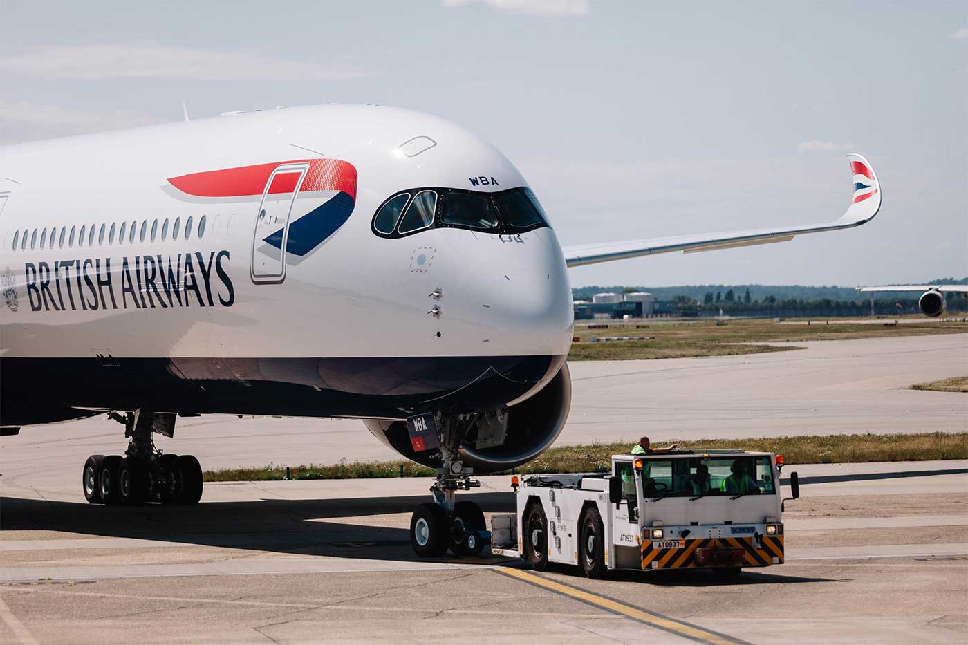 British Airways Airbus A350 being towed to the gate.