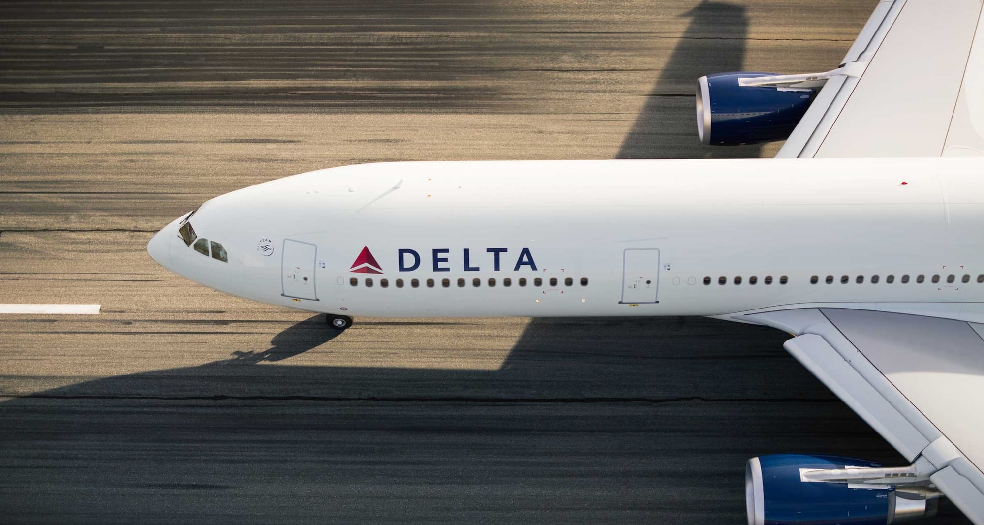 Aerial view of Delta Air Lines Airbus A330 aircraft on runway.