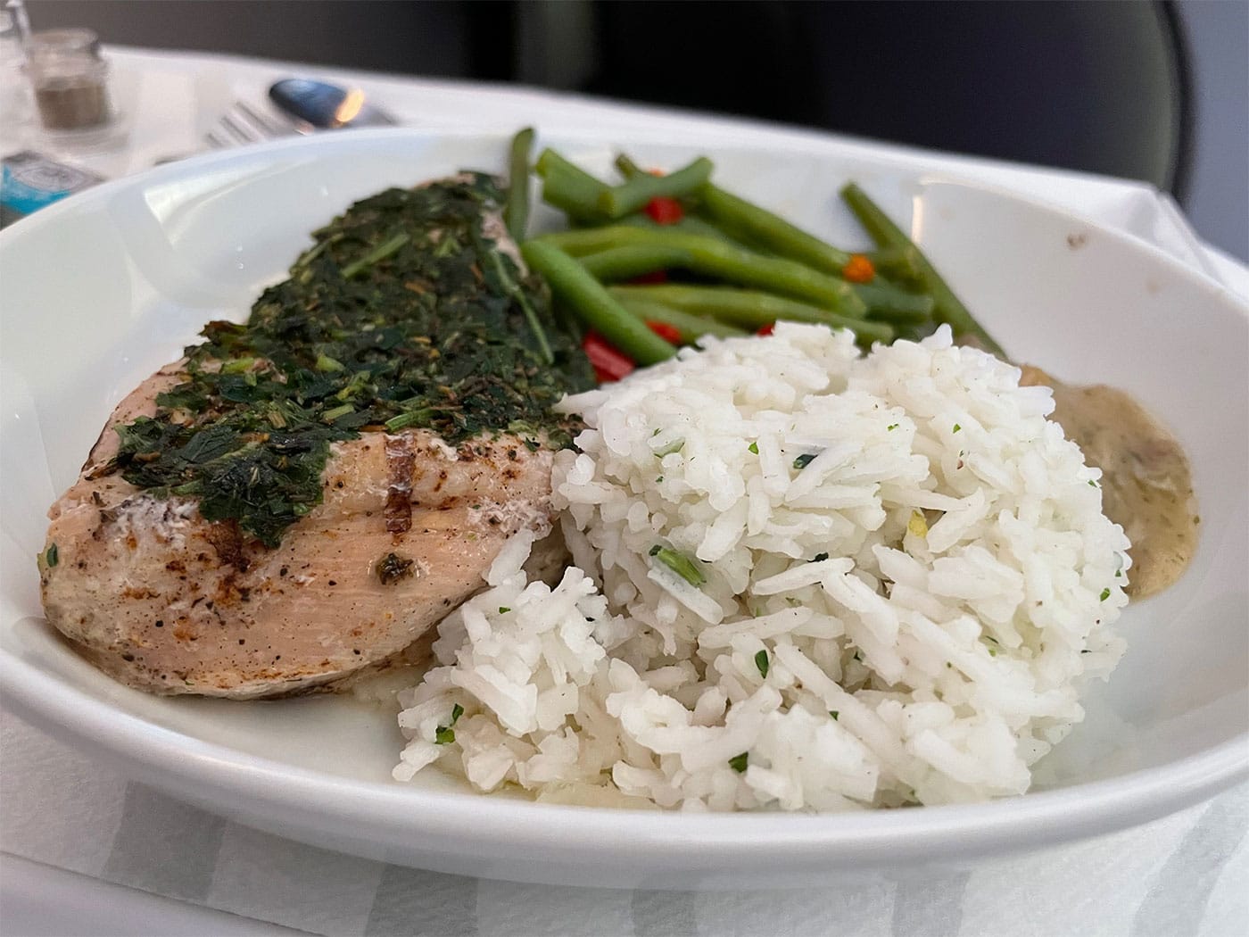 Main course of chicken, rice and green beans.