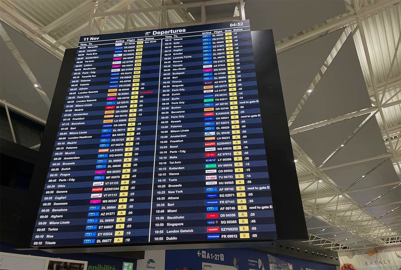 Departures board at Rome Airport.