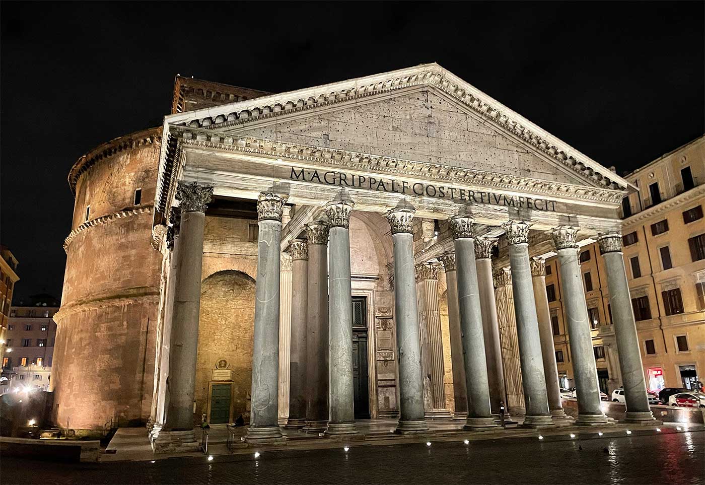 Front facade and exterior of the Pantheon at night.