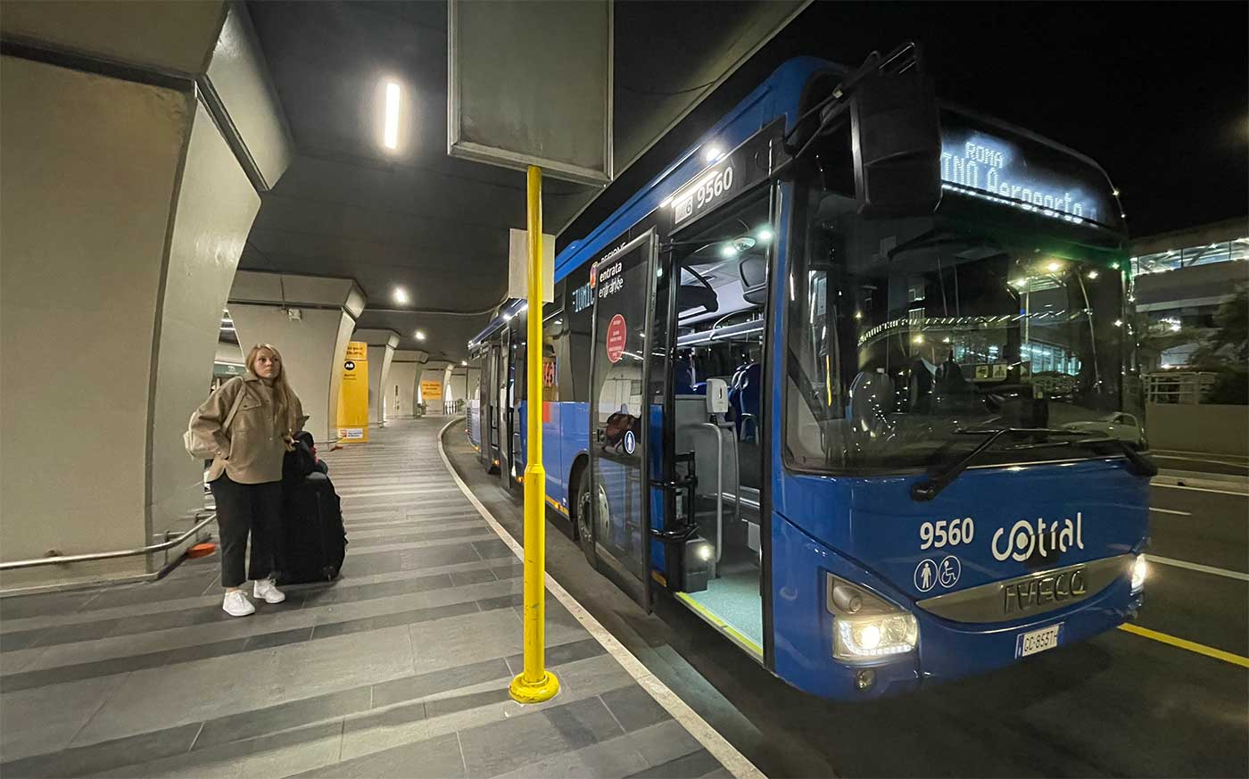 City bus at airport terminal.