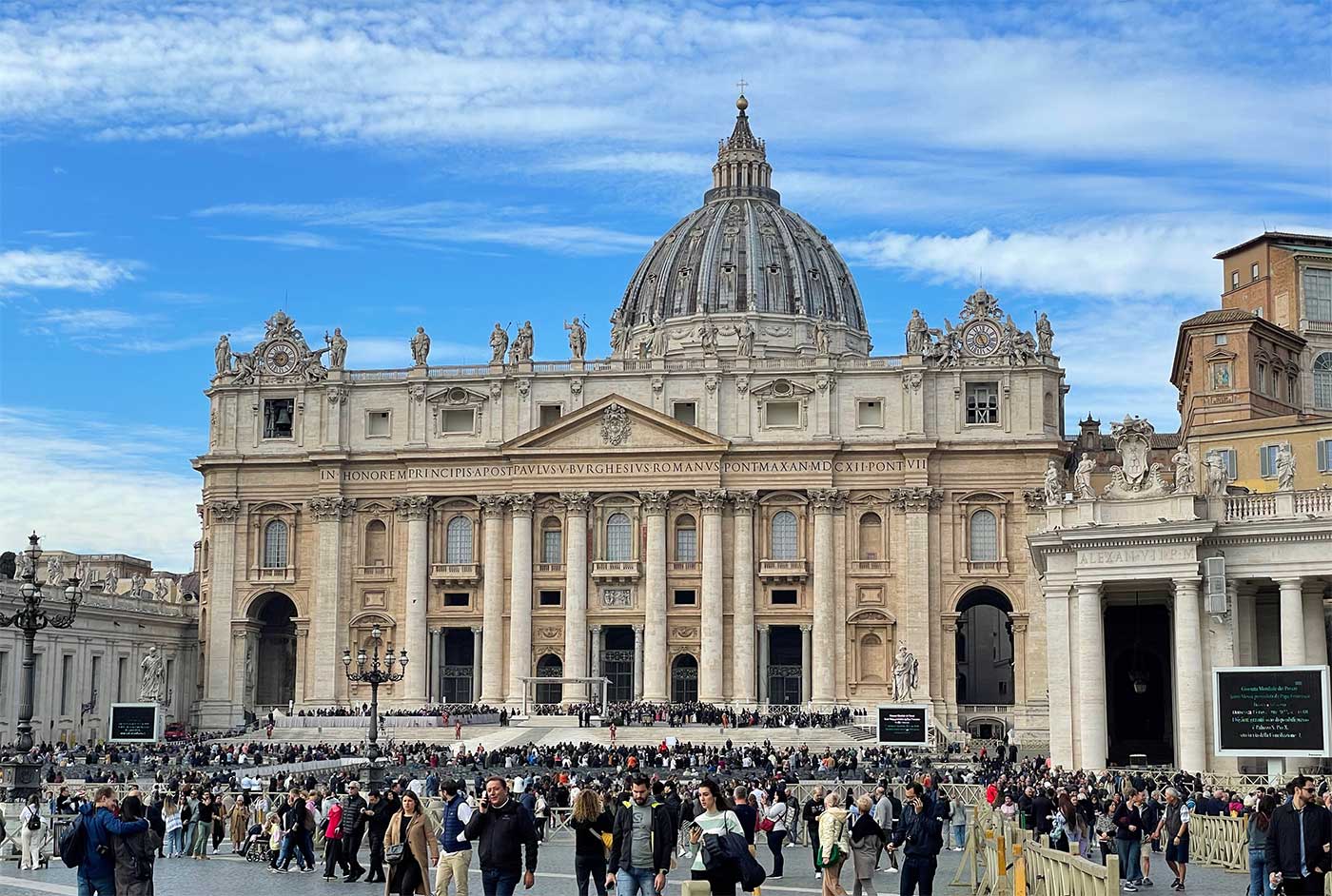 Exterior of basilica at the center of a square.