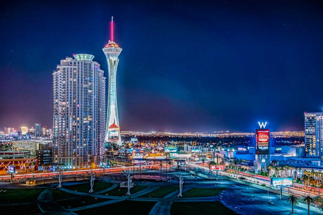 Stratosphere tower lit up in the night sky in Las Vegas.