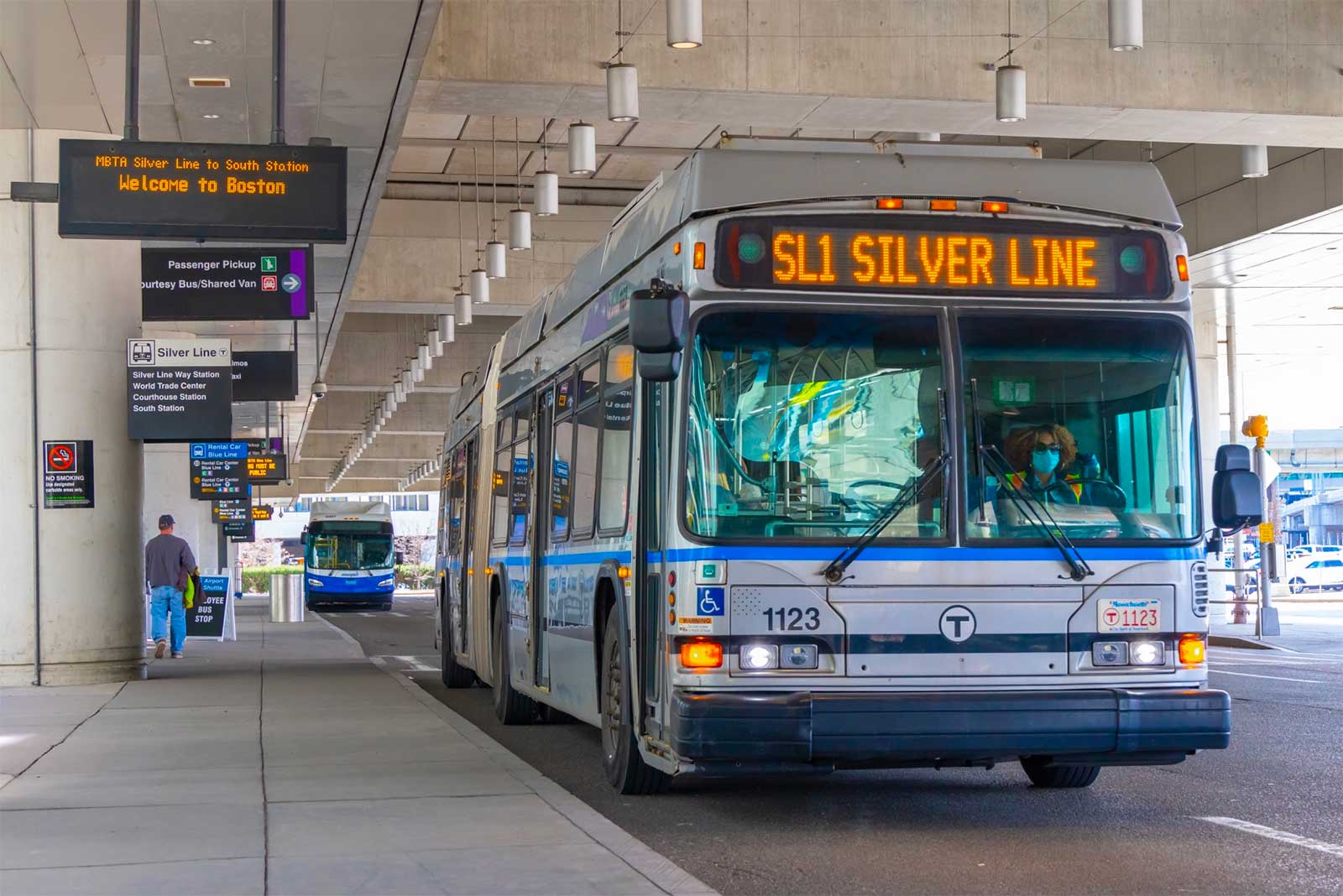 Silver Line bus parked at Boston airport terminal.