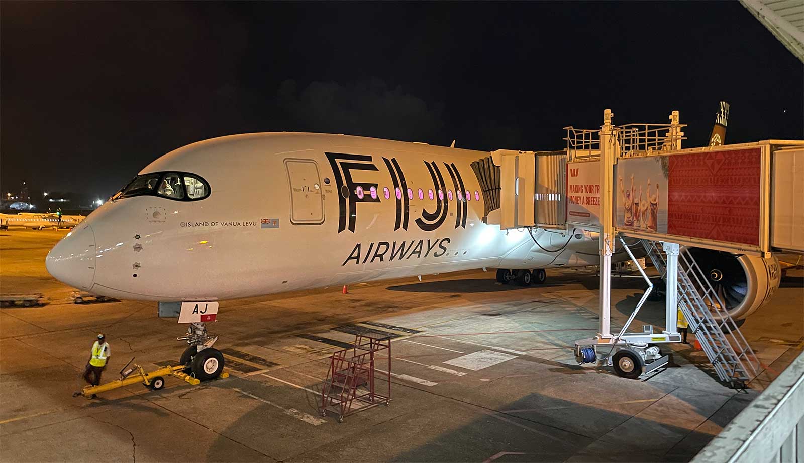 Fiji Airways Airbus A350 aircraft parked at airport gate in Nadi, Fiji.