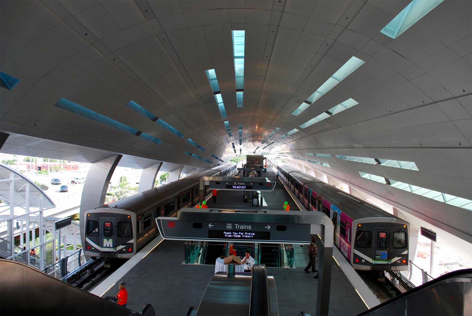 Two Miami metro rail trains at Miami Airport station.