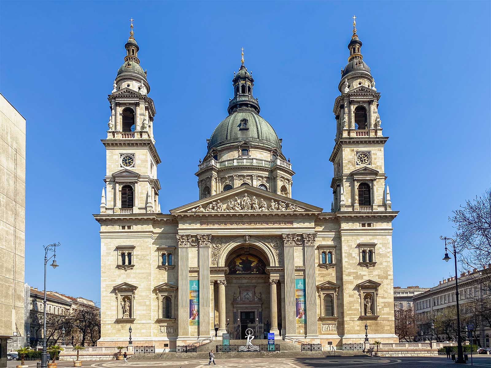 Exterior of basilica with dome and two towers.