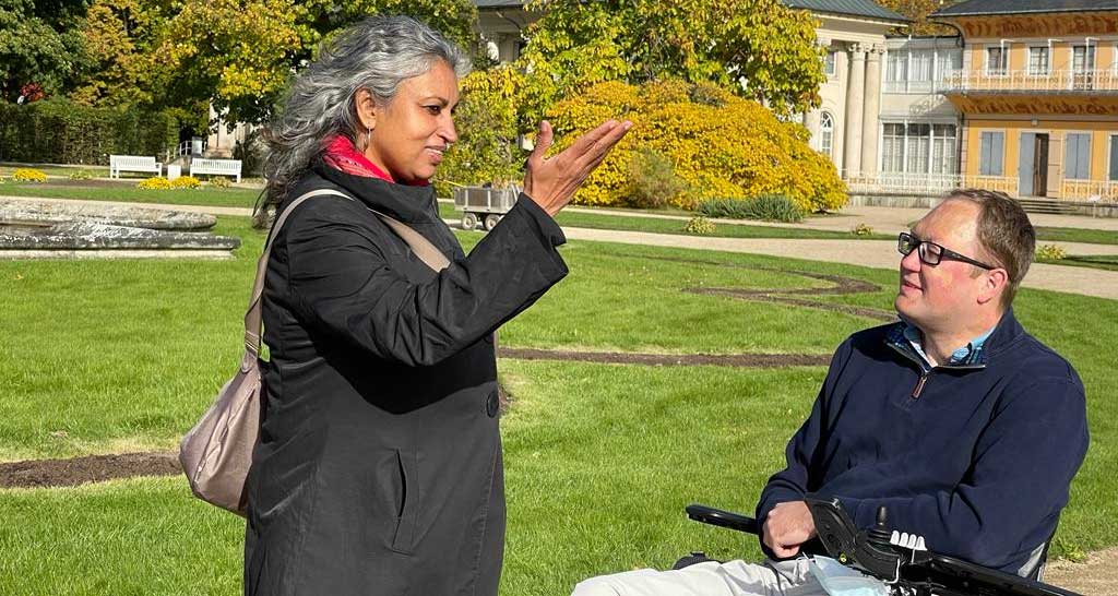 John listening to a tour guide in Germany.