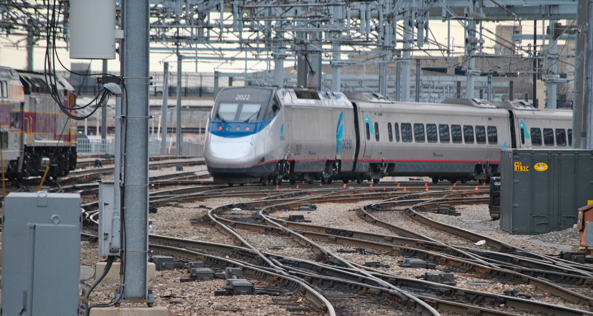 Acela train approaching Boston South Station.