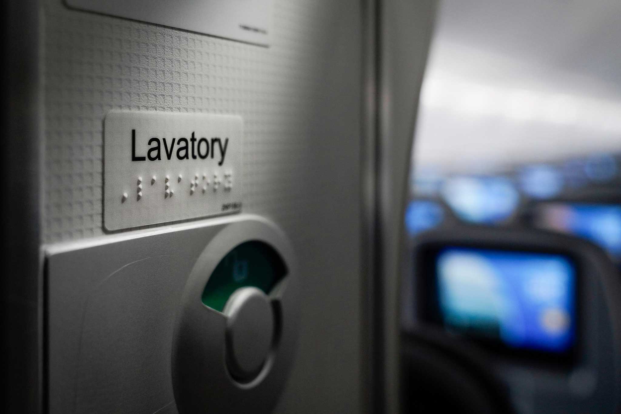 Braille signage on a lavatory door.