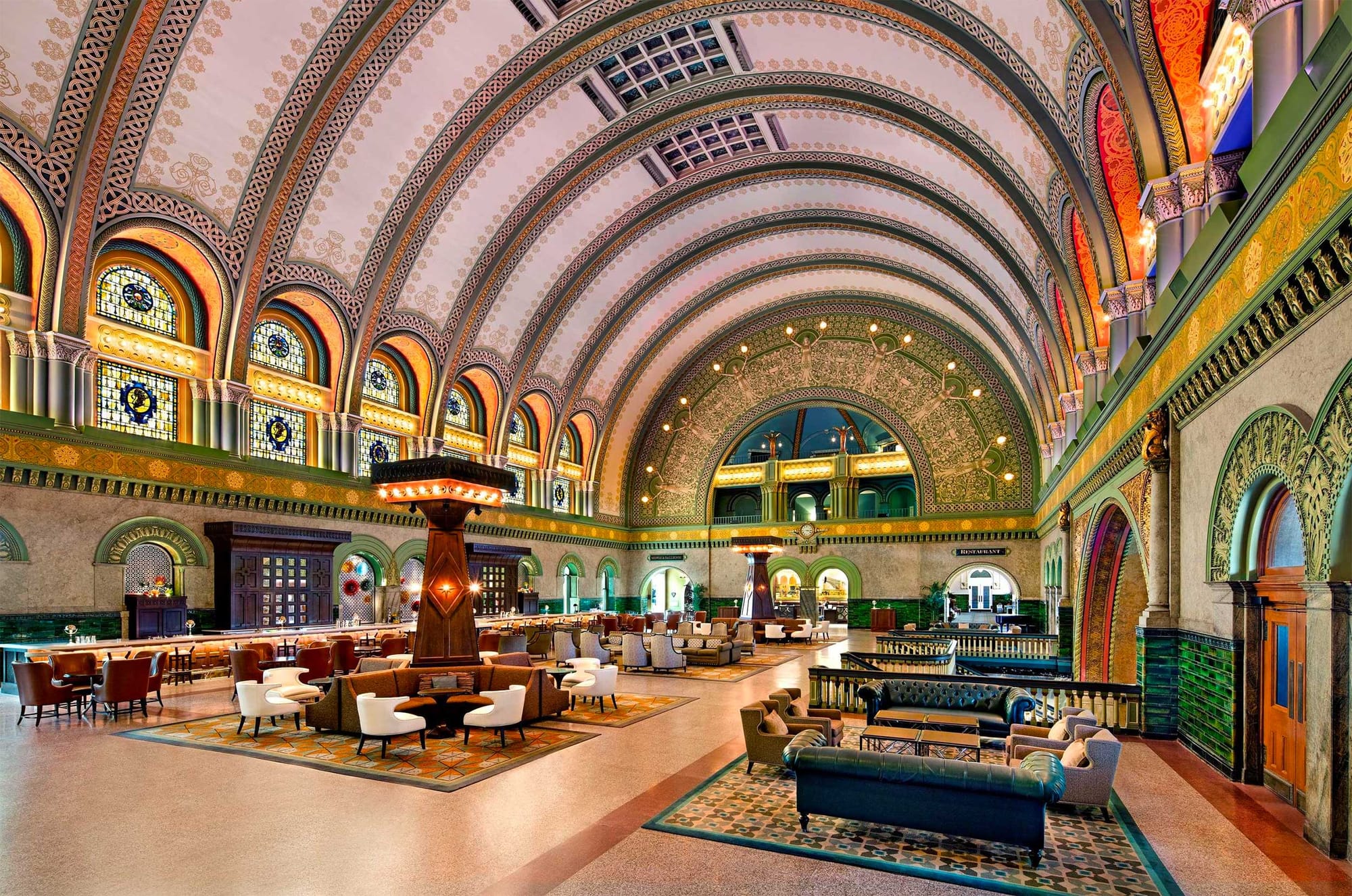 Ornately decorated Grand Hall with a semicircular ceiling.