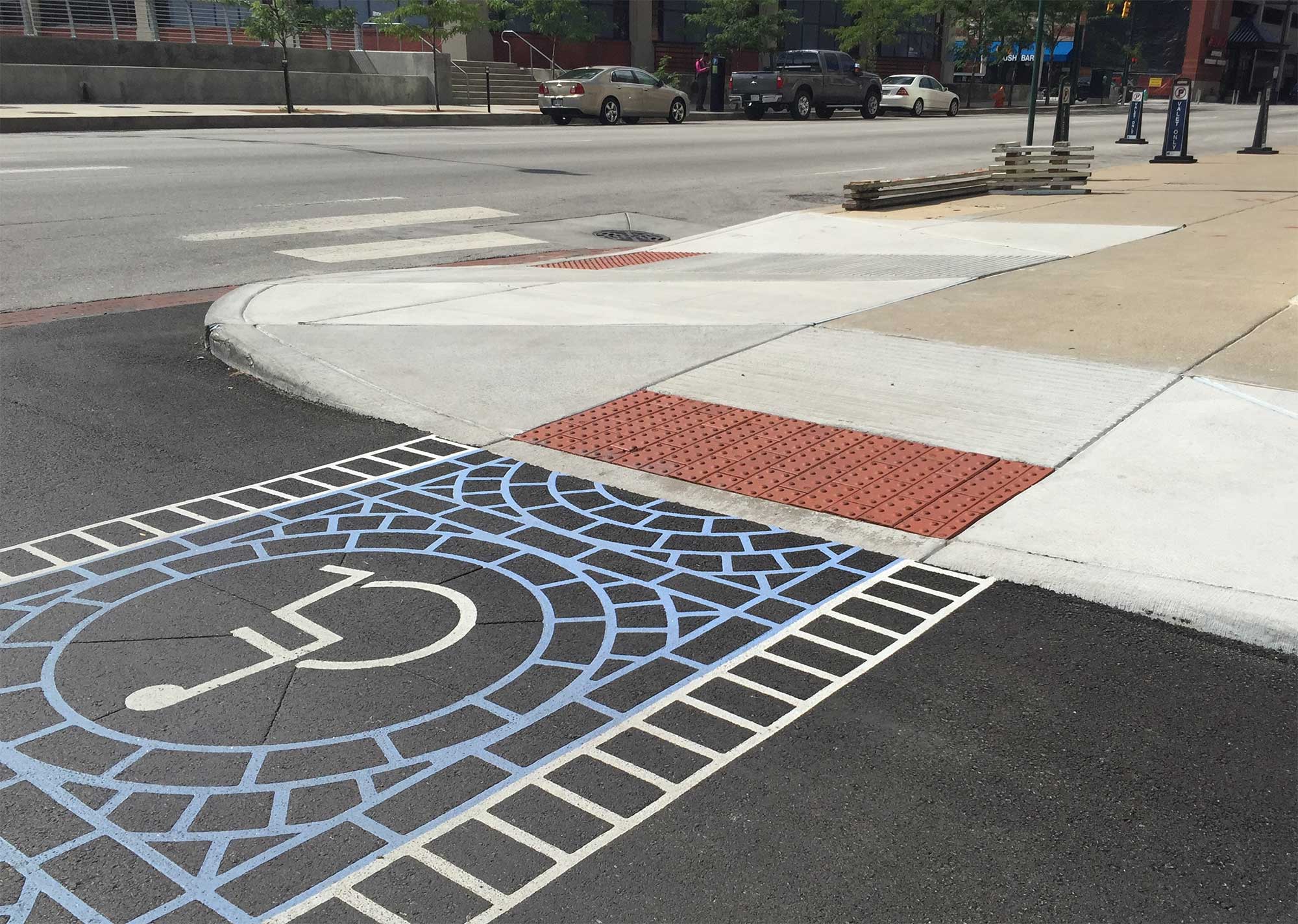 Wheelchair icon painted onto city crosswalk.