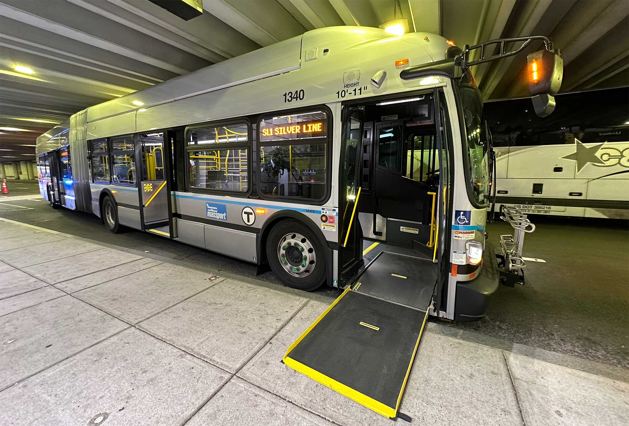 Ramp extended onto sidewalk from Silver Line bus.