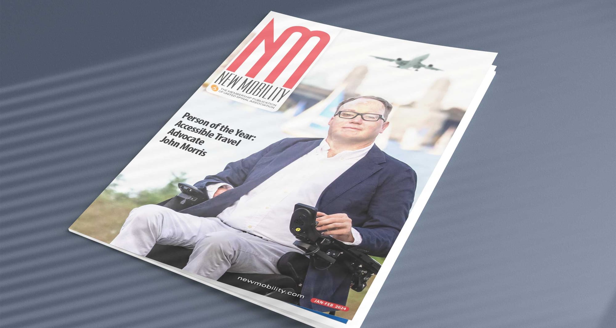 Photo of John on the cover of New Mobility Magazine, with text that reads, Person of the Year, Accessible Travel Advocate Joh