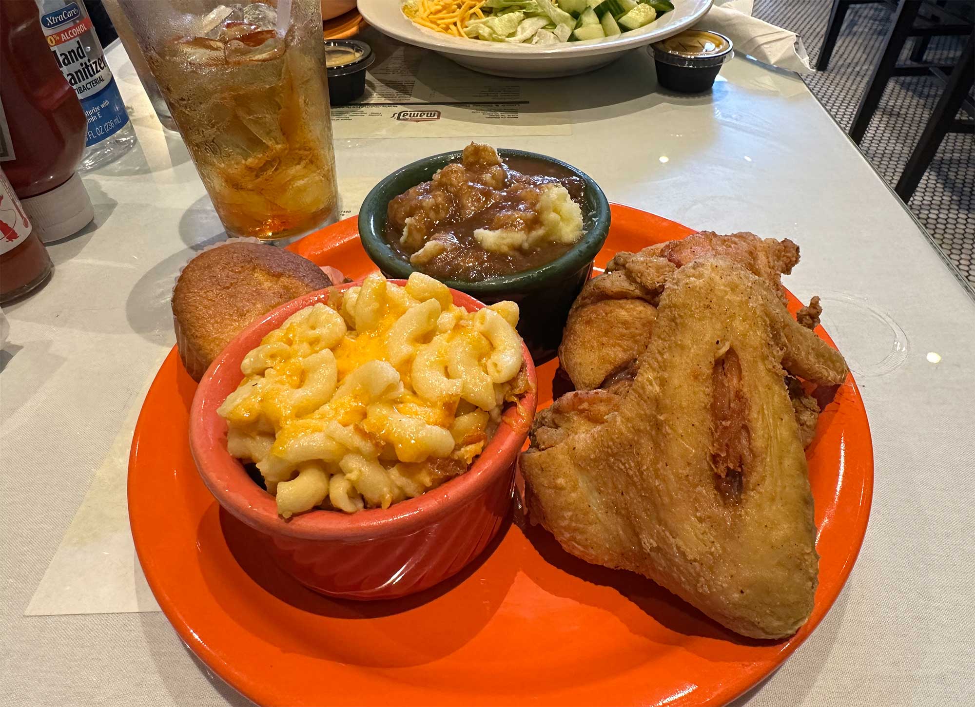 Fried chicken, macaroni and cheese, and mashed potatoes with gravy.