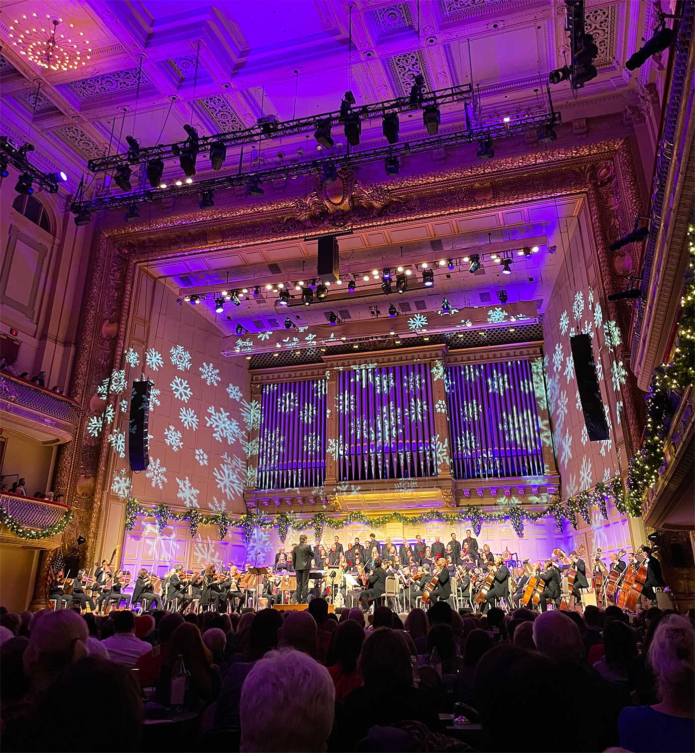 Orchestra on stage at Symphony Hall for a holiday performance.