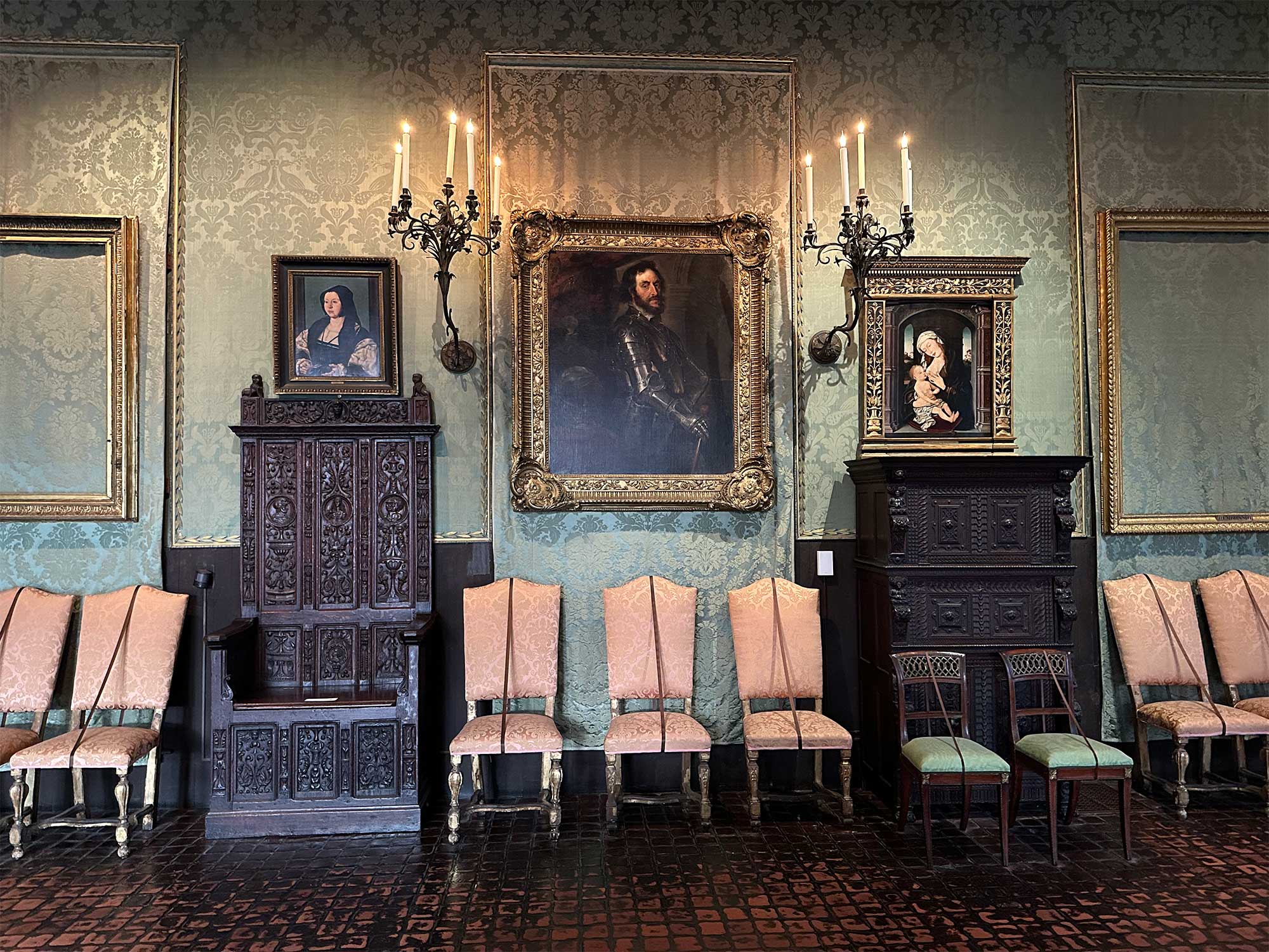 Room with two empty frames, from which paintings were stolen.