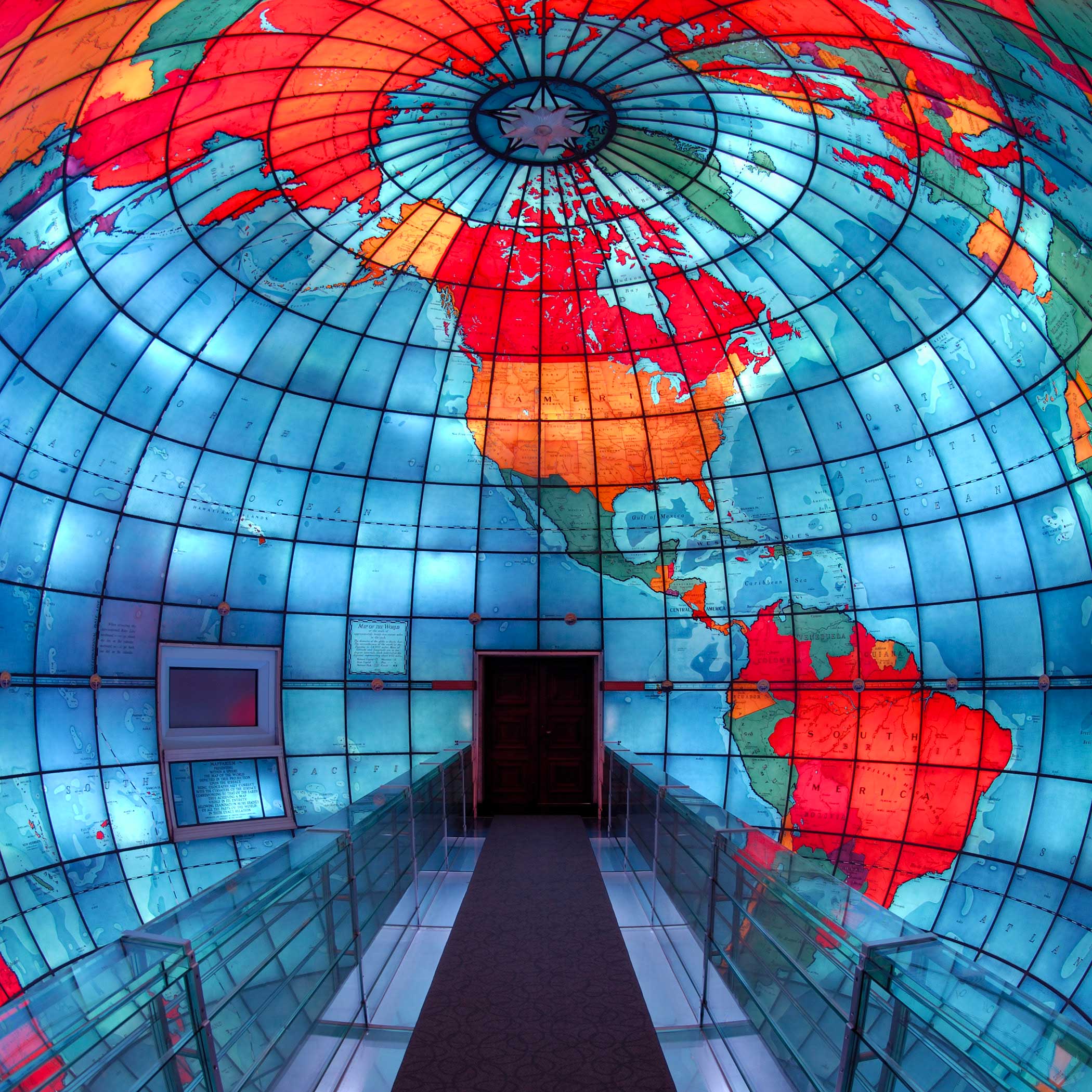 Bridge through a stained glass globe of the earth.