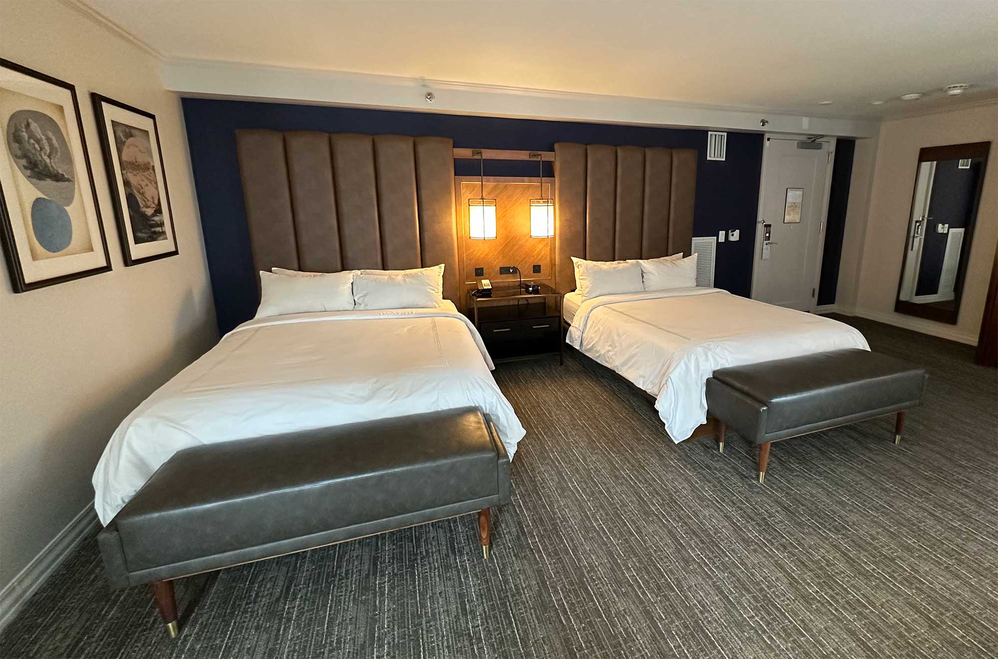 Two queen size beds in hotel room.