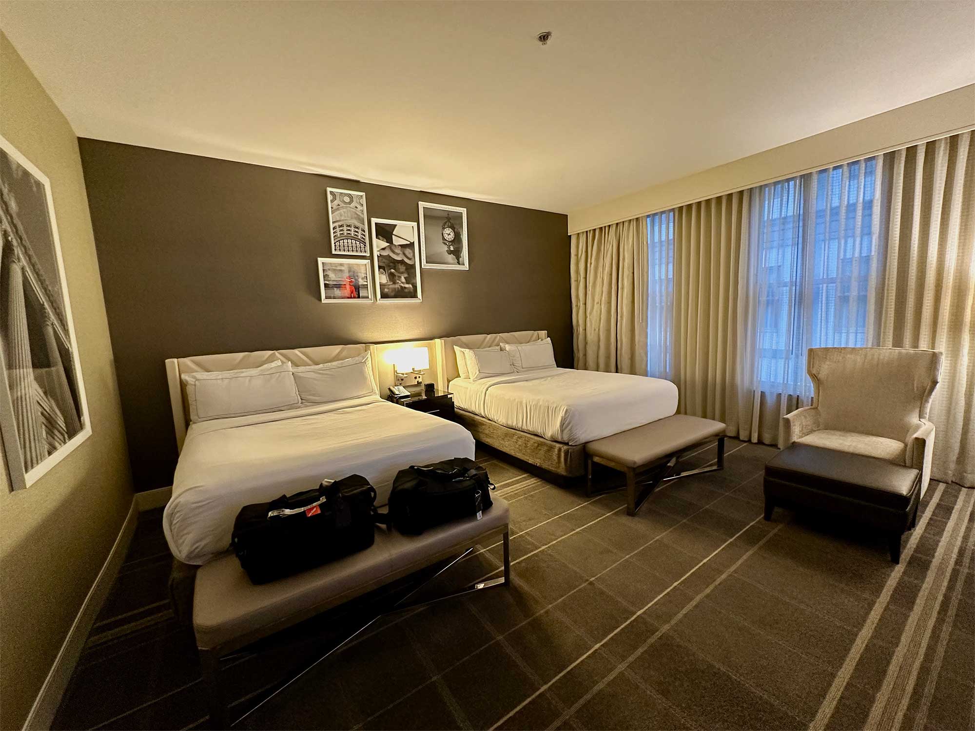 Two queen beds in a hotel room.