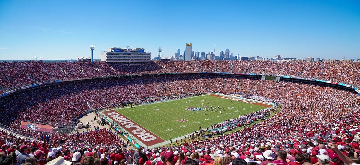 Cotton Bowl Stadium with Dallas skyline in the background.