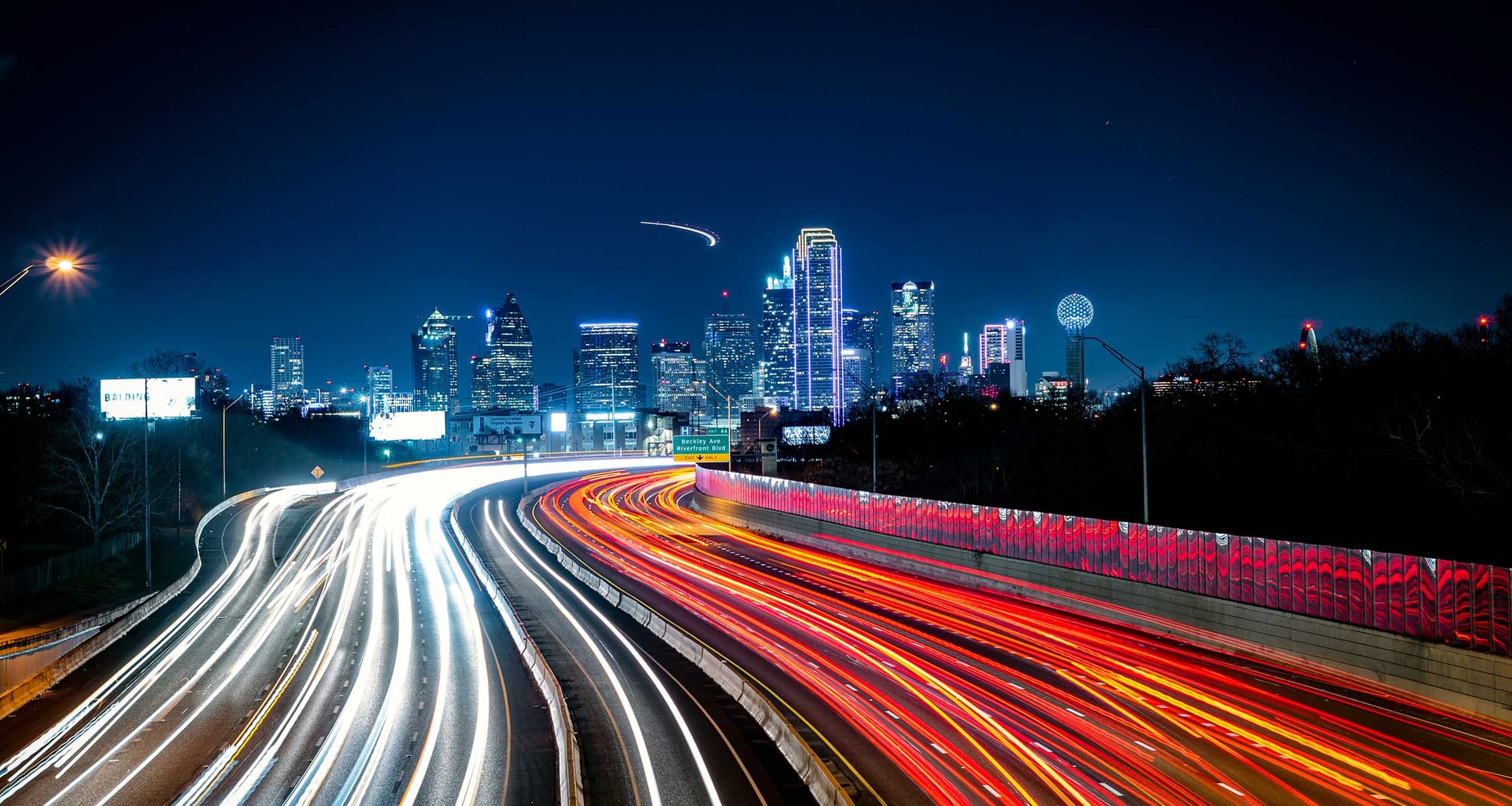 Dallas, Texas city skyline lit up at night.