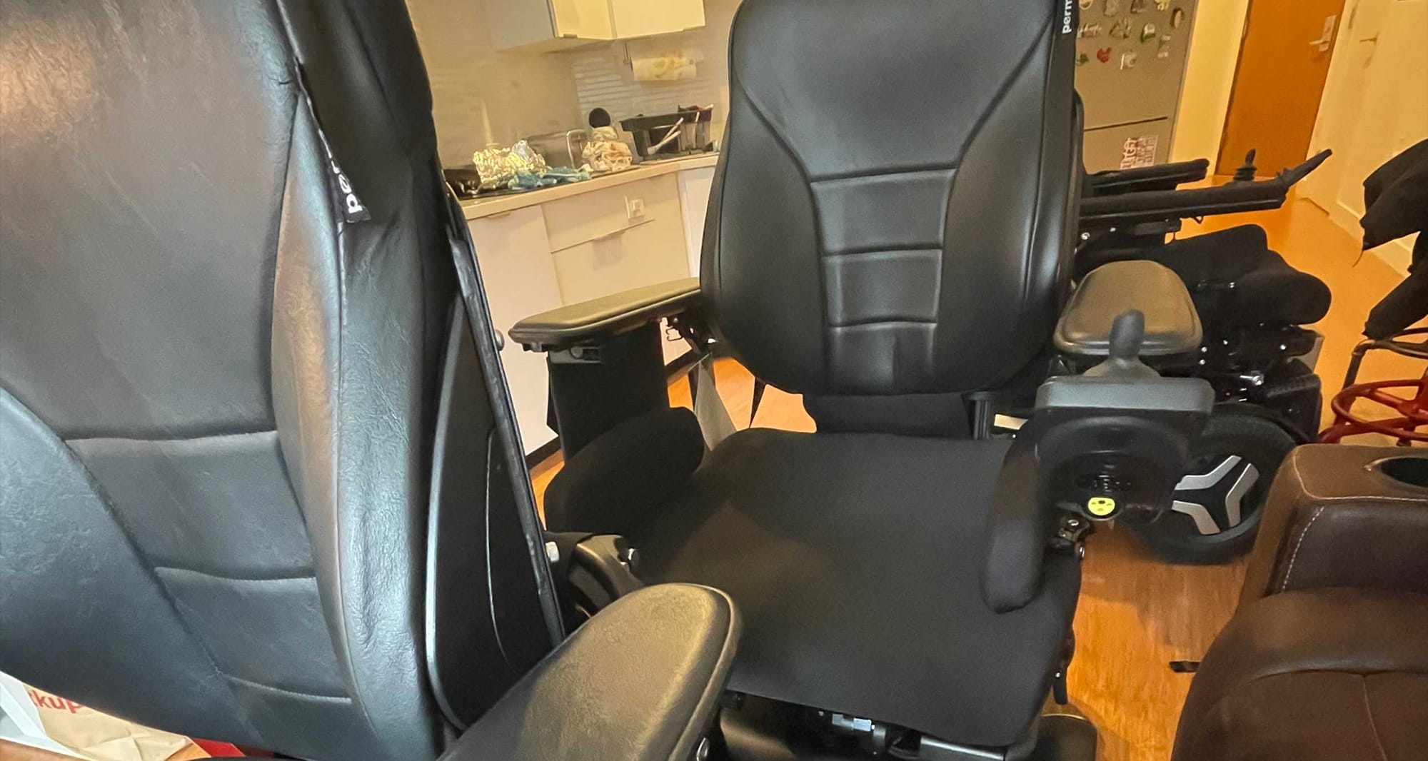 Multiple power wheelchairs in an apartment.