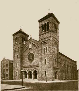 Historic, sepia toned photo of church with two bell towers.