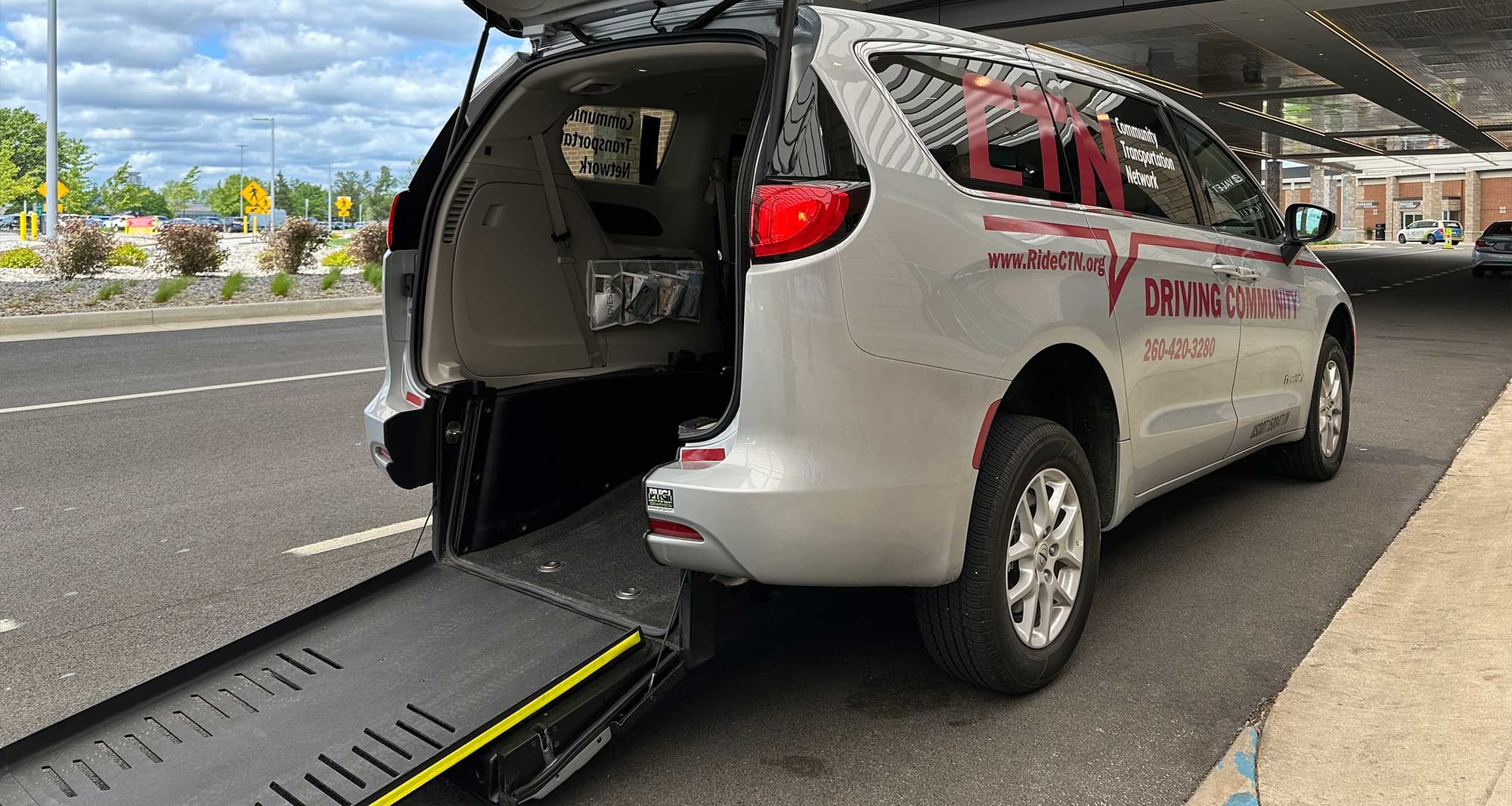 Minivan with rear entry wheelchair ramp.