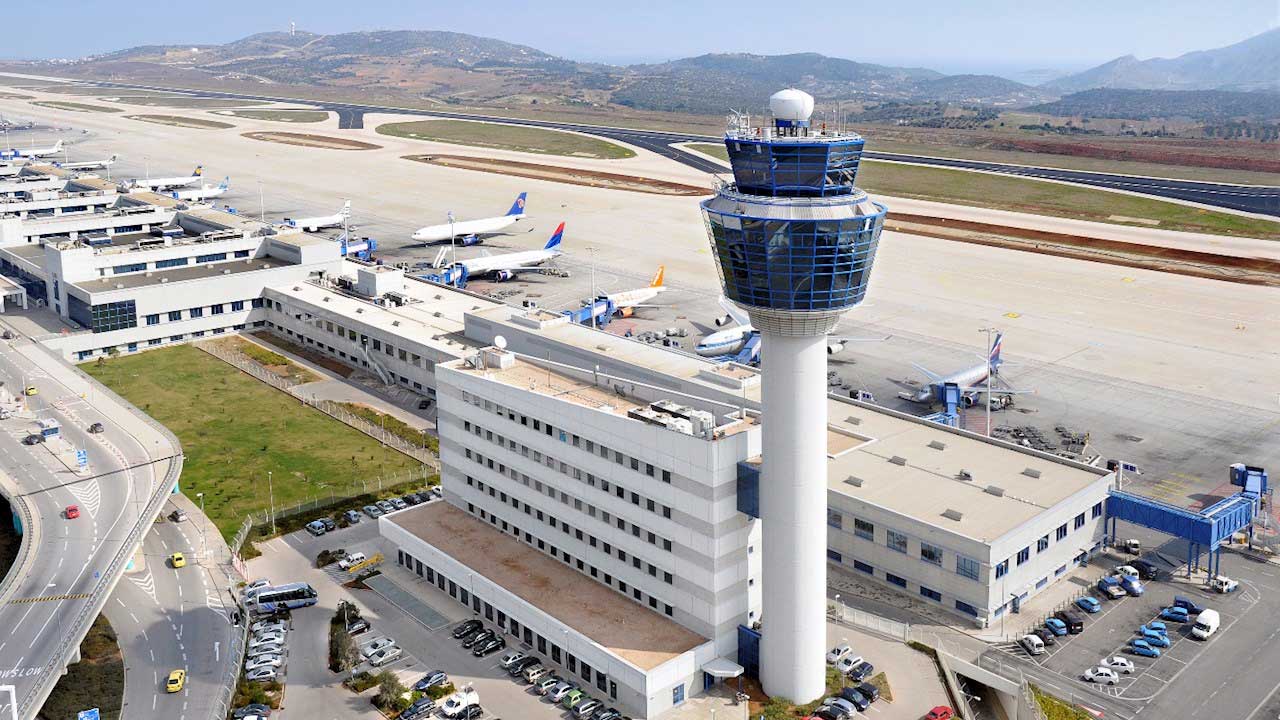 Aerial view of Athens Airport control tower and terminal building.