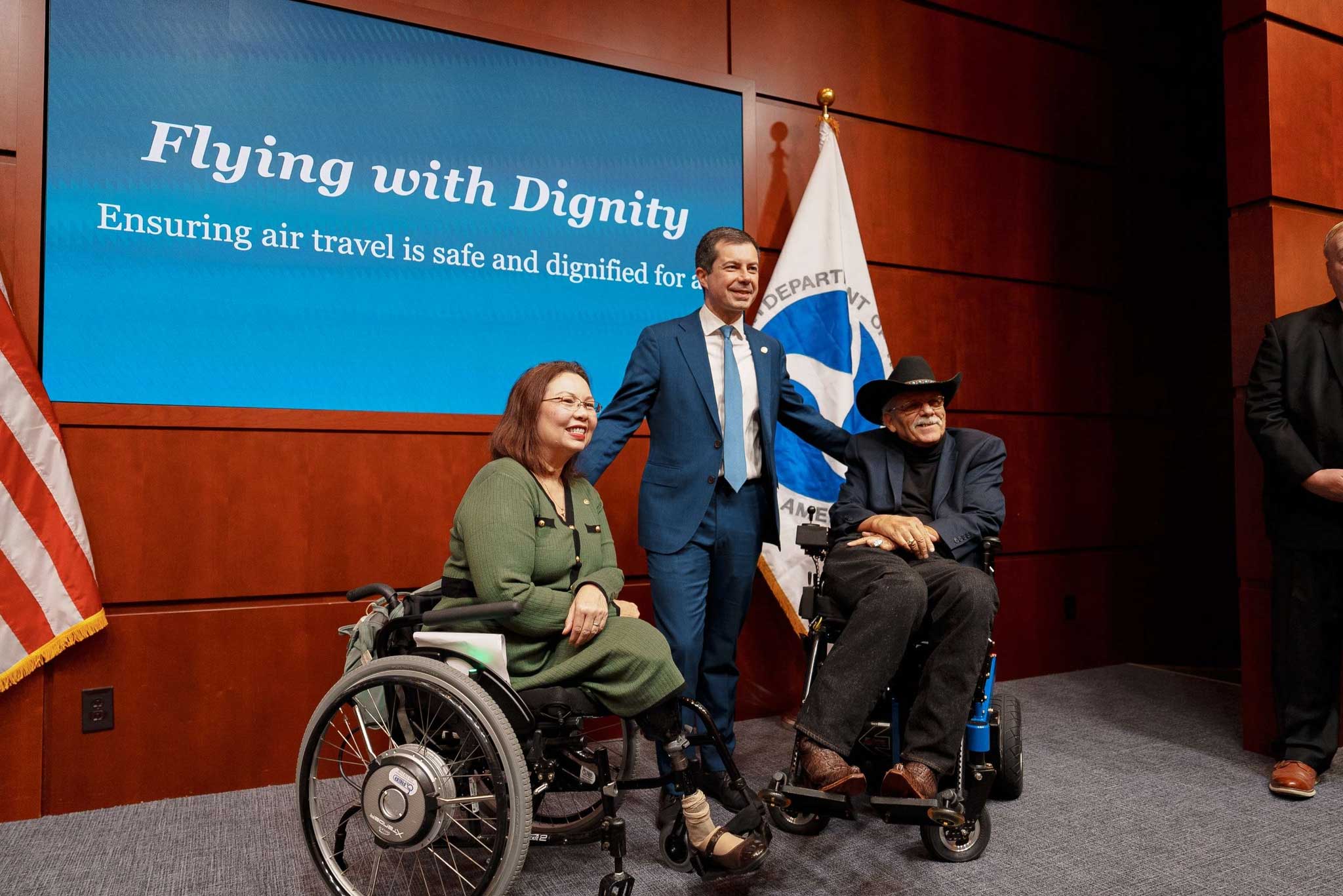 Secretary Pete pictured with Senator Tammy Duckworth and DOT Disability Policy Advisor Kelly Buckland.